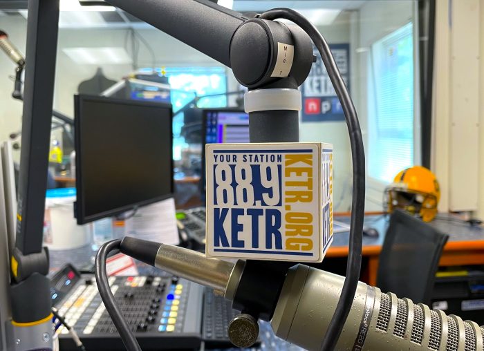 A close up photo of a radio station microphone featuring the logo of 88.9 KETR FM