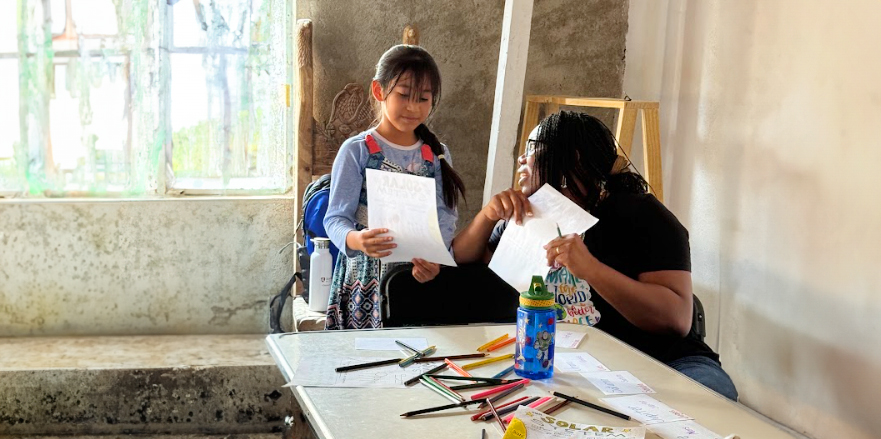 A woman teaching a student in Mexico.