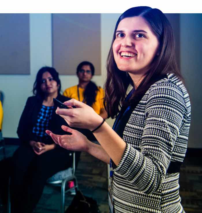 A student presenting in front of an audiance.