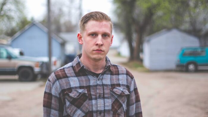 An outdoor headshot of a person.