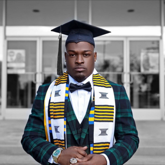 A headshot photo of a person in a college graduation cap and gown.