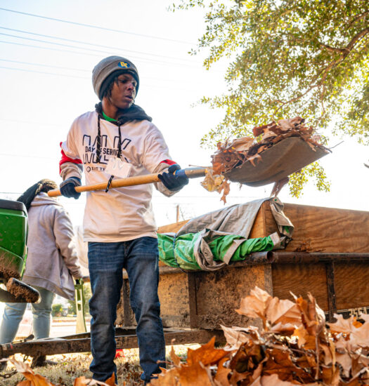 Two students volunteering for community cleanup