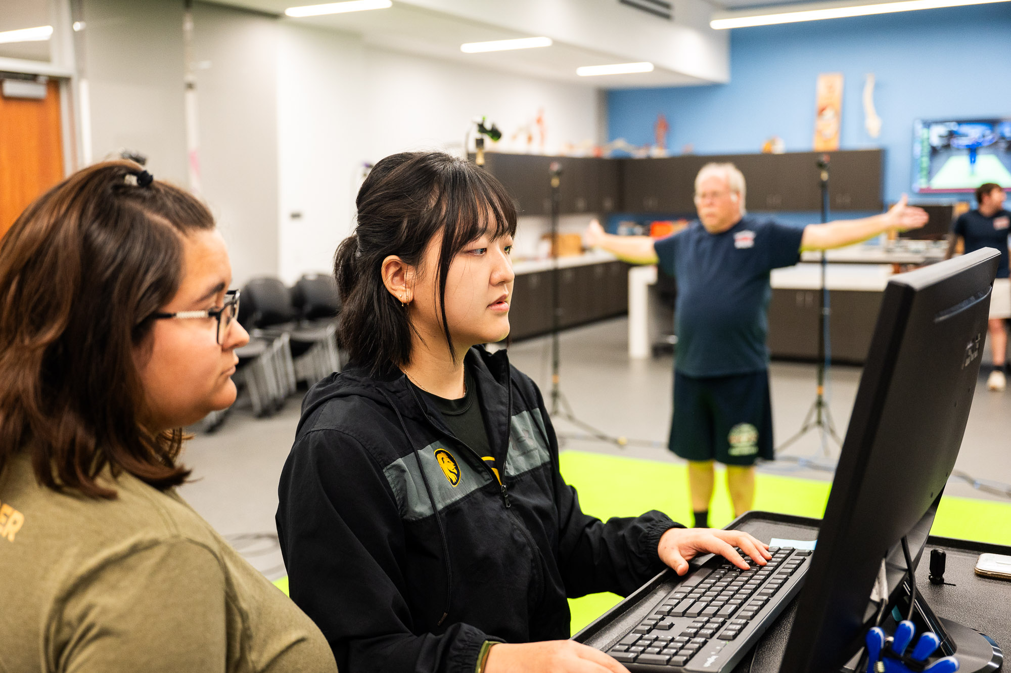 Researchers at East Texas A&M University analyze motion data as a participant undergoes a movement assessment in a biomechanics lab.