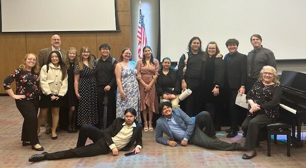 A group of people pose for a photo.